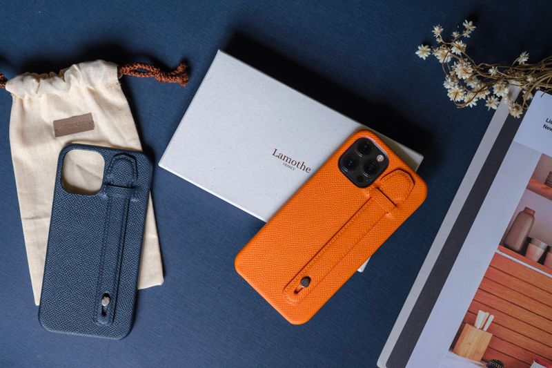 Premium custom phone case closeup showing vibrant print colors and precise camera cutout on a metal case