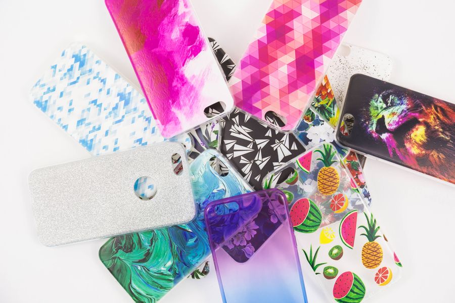 Collection of cute and colorful aesthetic phone cases in various patterns and designs displayed together